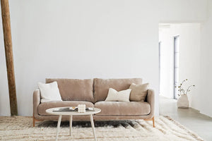 The Walcot beige velvet sofa with oak legs